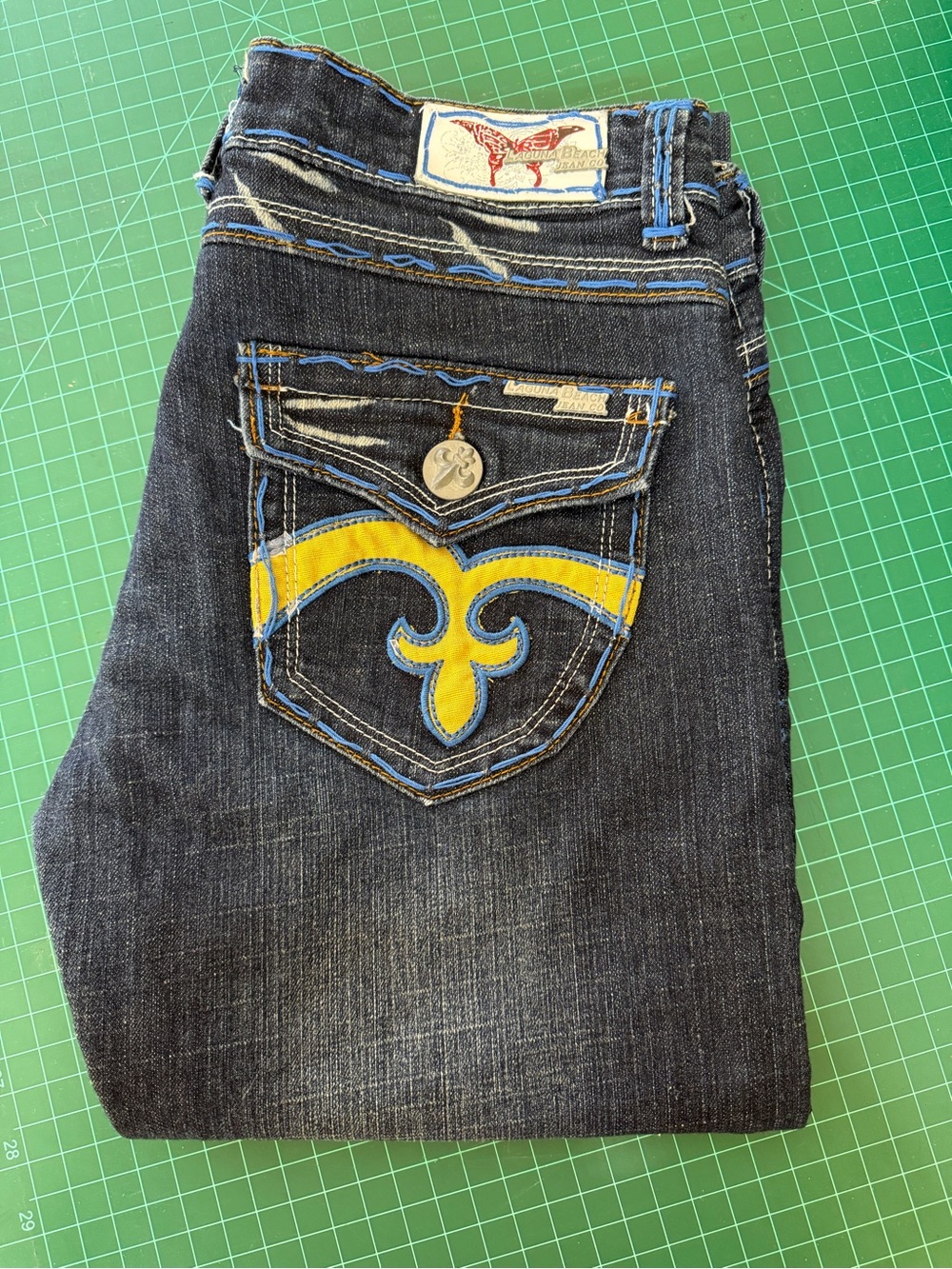 Women’s Dark Denim Jeans with Yellow Pocket Fleur De Lis Accent